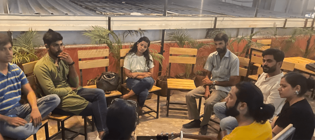 group of people sitting in outdoor setting of a coworking space in jaipur
